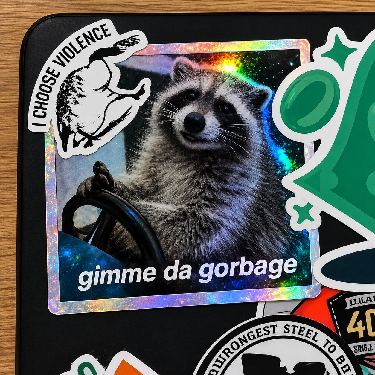 Holographic sticker of Rocket saying gimme da gorbage